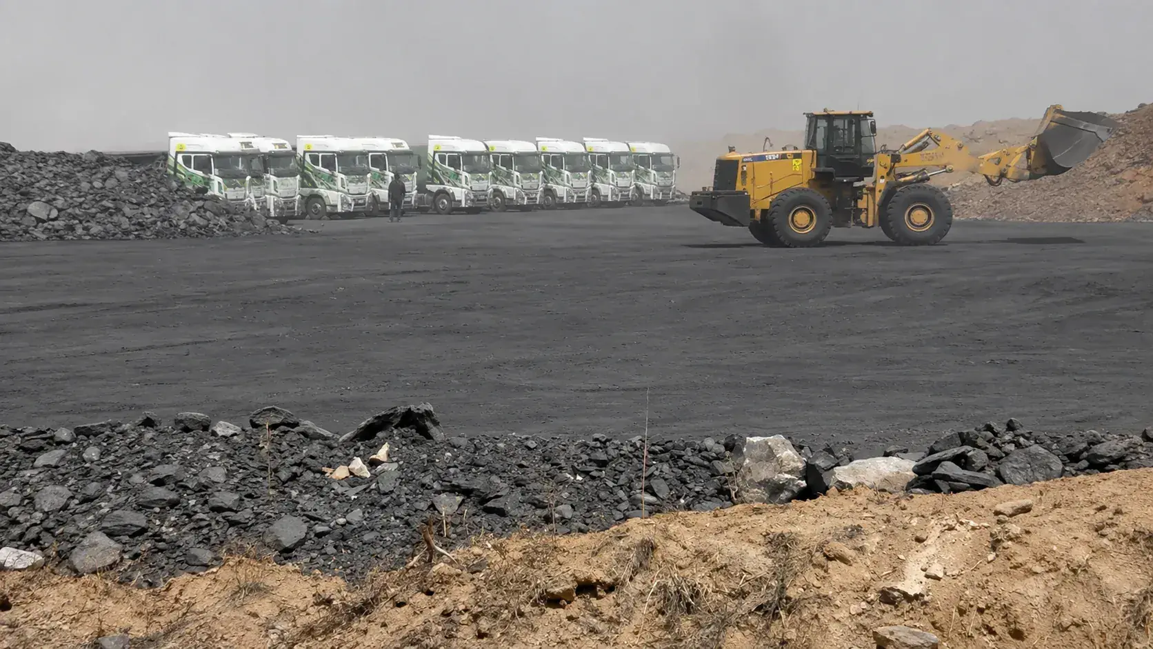 Mwalimu haulage fleet loading at a coal stockpile